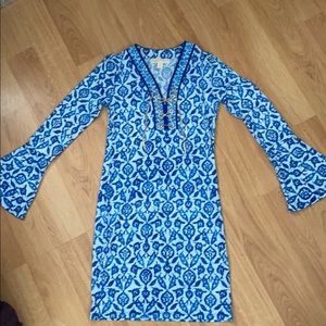 Michael Kors blue print dress with gold chain adornment.